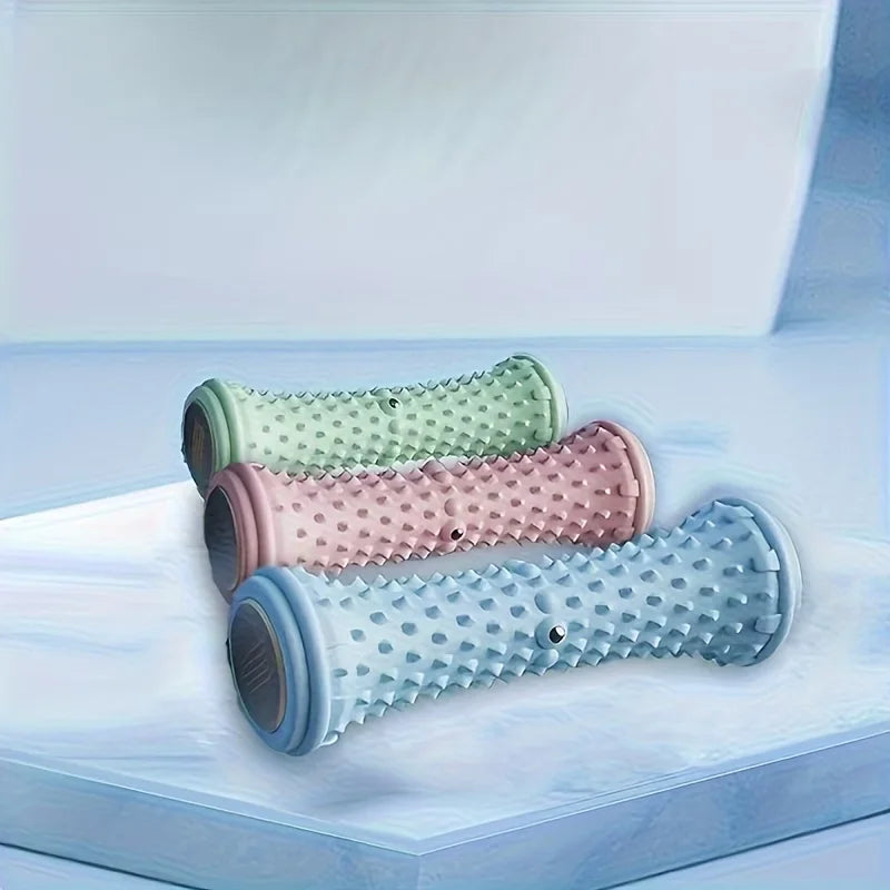 Trois rouleaux de massage plantaire PuraDorse Roll, coloris vert, rose et bleu, posés côte à côte
