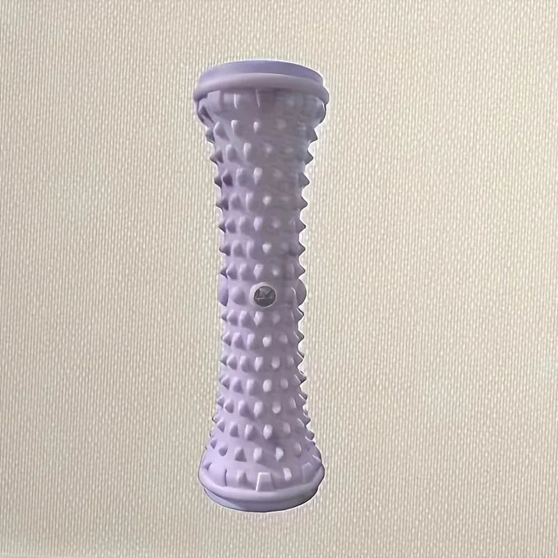 Rouleau de massage plantaire PuraDorse Roll violet, vu de face sur fond écru